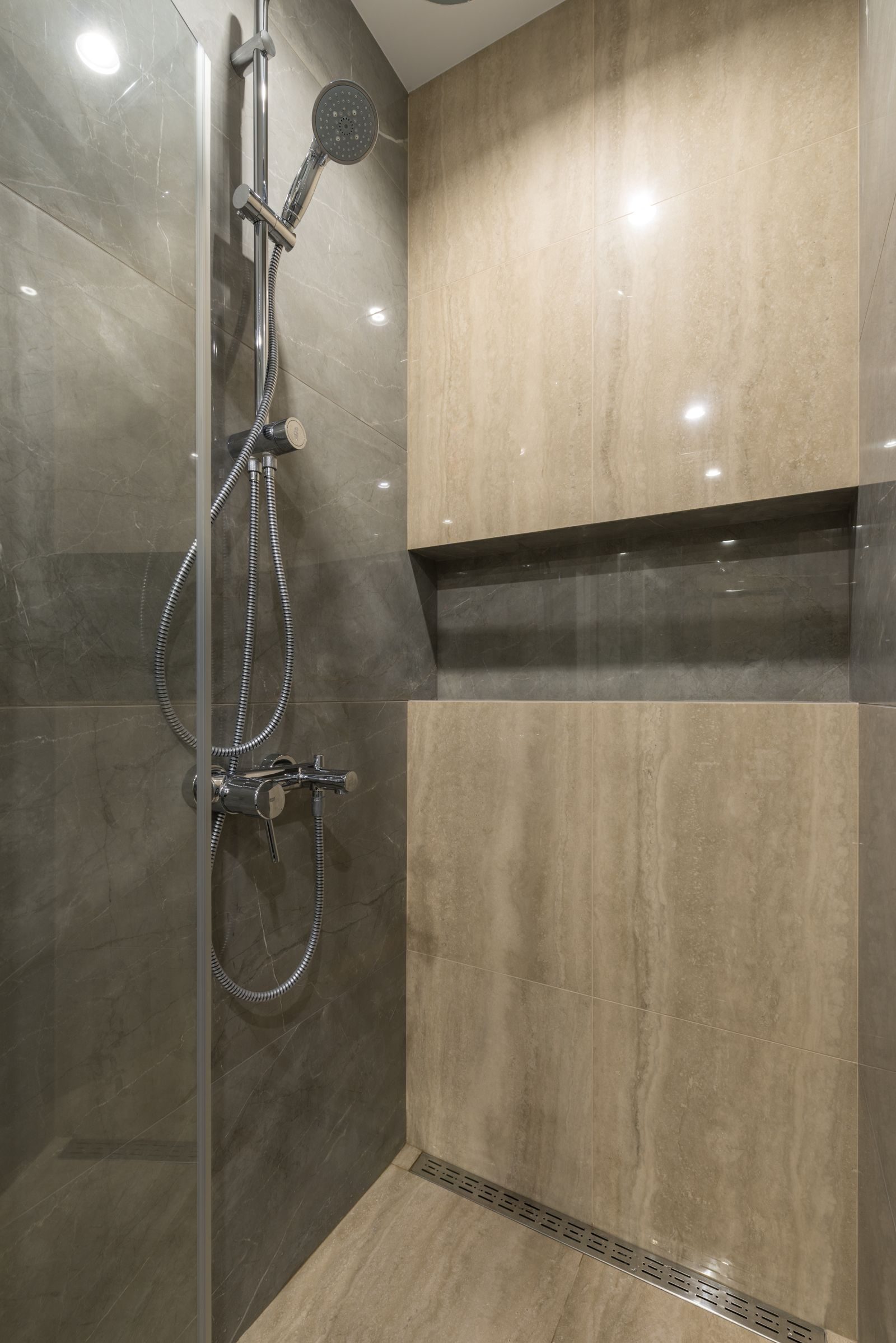 A level-access walk-in shower with linear drain